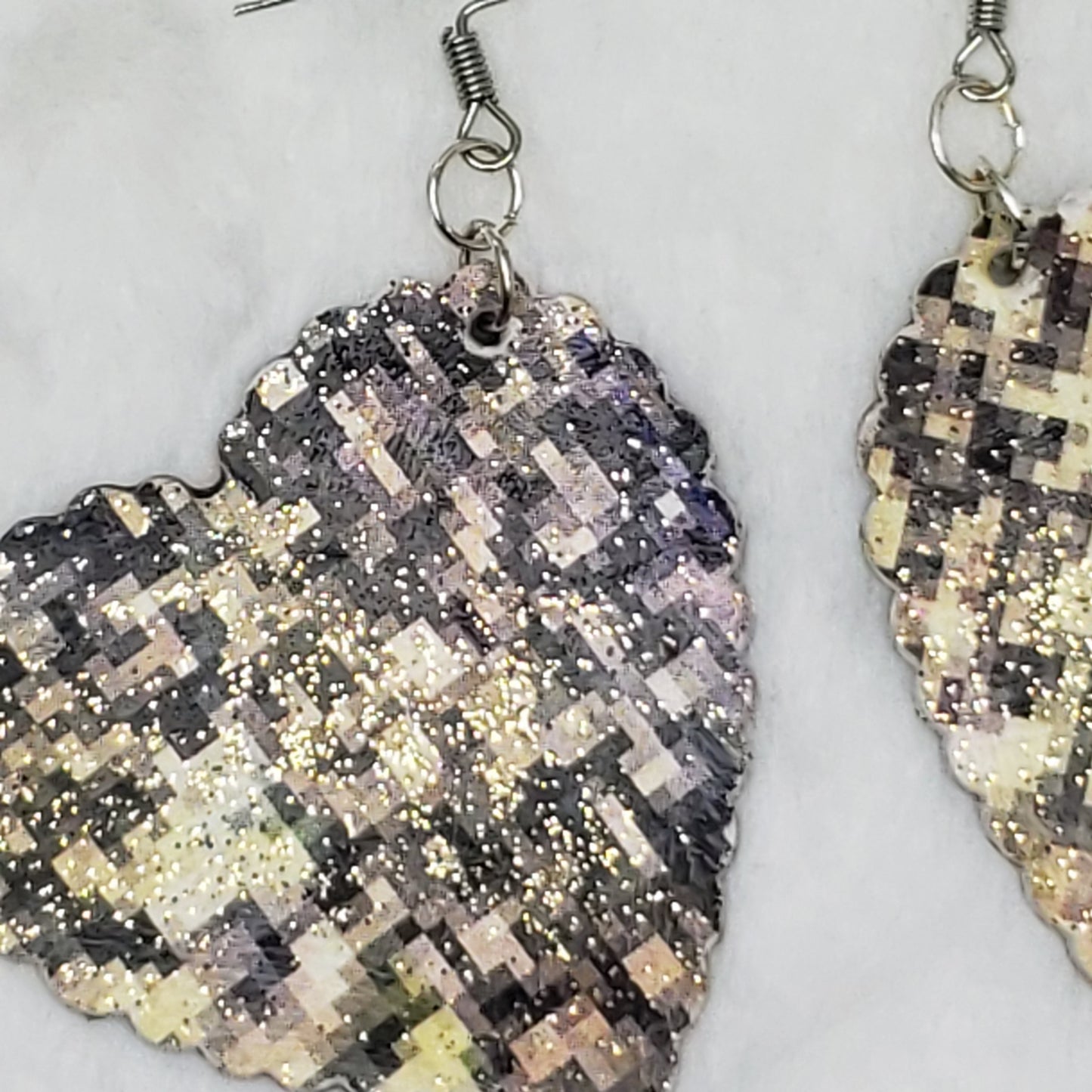 Black and gold pixilated hearts