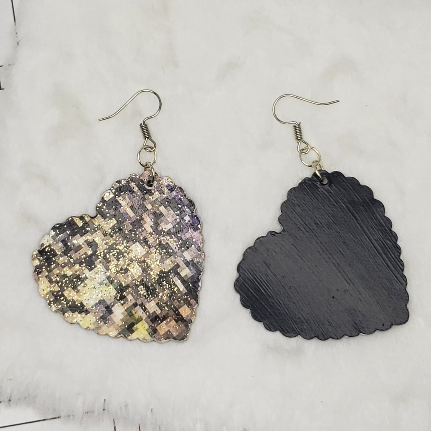 Black and gold pixilated hearts